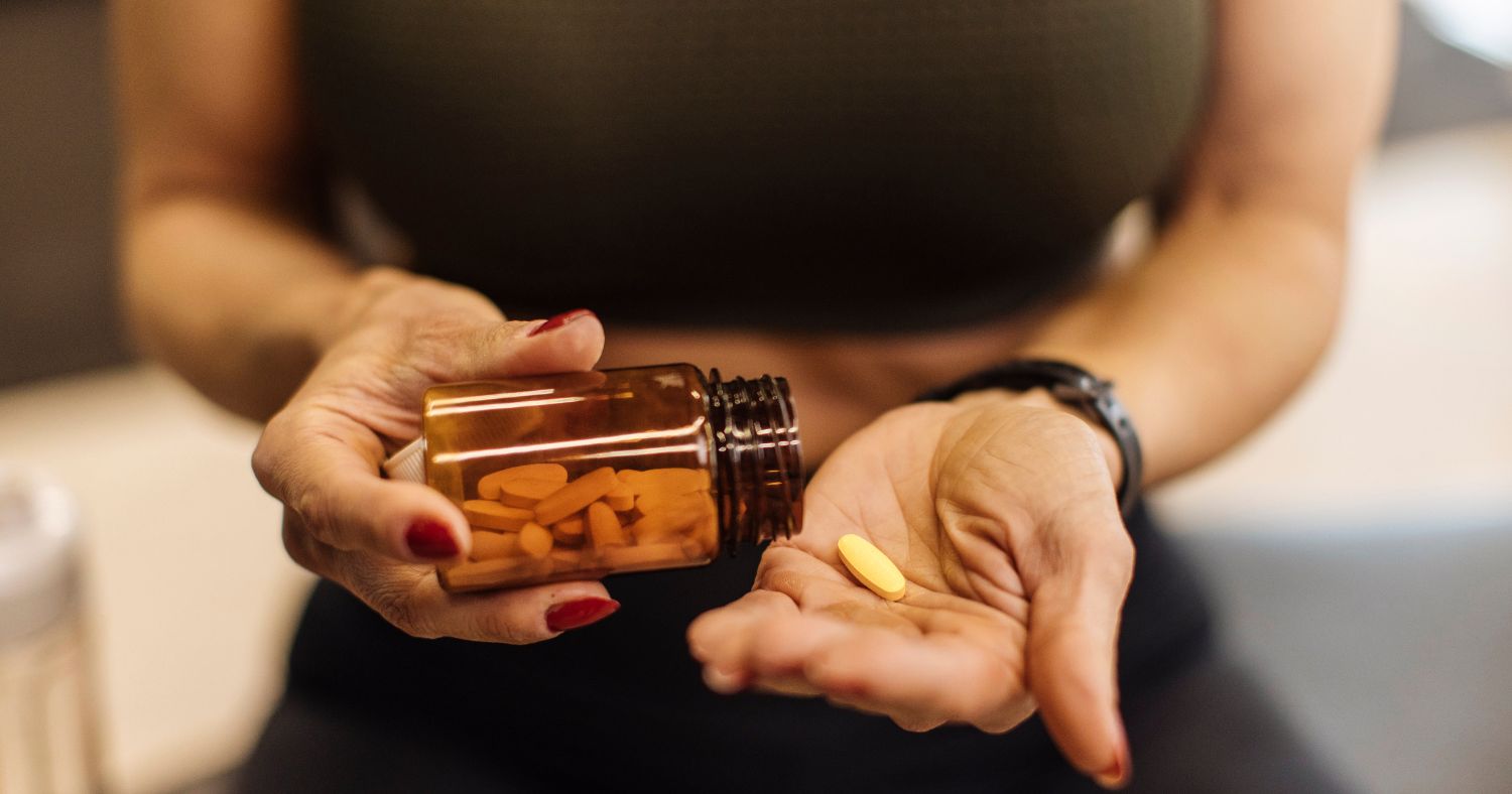 woman taking supplement