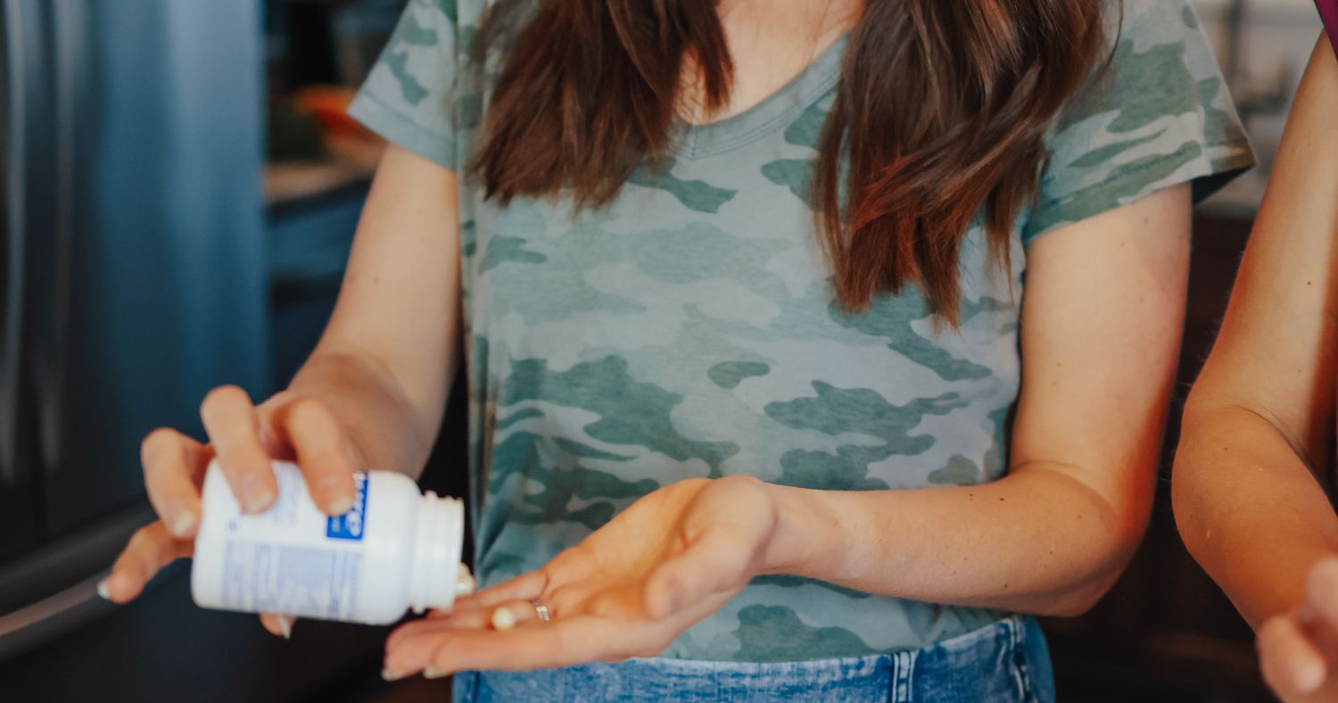 woman taking magnesium supplement
